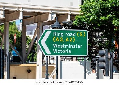 London, UK United Kingdom And Green Traffic Sign Directions To Ring Road And Westminster Victoria On Sunny Summer Day