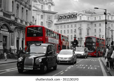 LONDON ,UK: View Of Street On AUGUST 30, 2014 In London. Red Busies And Taxi Is Popular Kind Of Transports In London,Double-decker Buses With Black And White Background