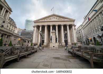 London. UK-01.12.2020: The Royal Exchange Building In The Financial District On A Sunday Morning With Empty Seat Benches Outside. Currently A Shopping Arcade.