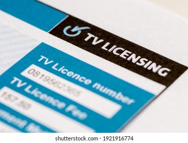 London. UK-02.19.2021: a television licence in paper form issued by TV Licensing with the licence number and fee paid. A legal requirement for watching television broadcast in Britain.