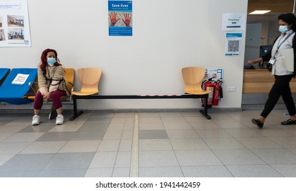 London. UK-03.22.2021: Interior Of A National Health Service Hospital Trust With Patients And Staffs Wearing Face Mask And Social Distancing During Covid-19 Pandemic