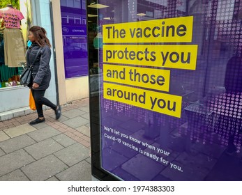 London. UK-05.14.2021:  A NHS Government Billboard Advertisement On The High Street Of The East End Ecouraging The Public To Take Up The Covid-19 Vaccination.