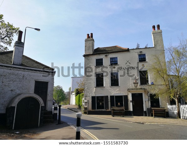 LONDON, UK-19 APRIL 2019: Old buildings of\
Spaniards Inn is an historic Wood-panelled pub with homely\
fireplace on Spaniards Road opposite to Toll Gate House between\
Hampstead and Highgate in\
London