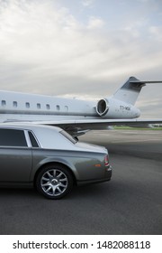 London, UK-7 MAY, 2019: Private Executive Airplane With Limousine Rolls Royce Phantom Luxury Car Shown Together At International Heathrow Airport. VIP Service At The Airport. Business Class Transfer.