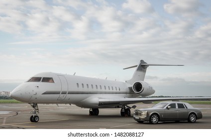 London, UK-7 MAY, 2019: Private Executive Airplane With Limousine Rolls Royce Phantom Luxury Car Shown Together At International Heathrow Airport. VIP Service At The Airport. Business Class Transfer.