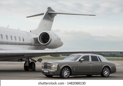 London, UK-7 MAY, 2019: Private Executive Airplane With Limousine Rolls Royce Phantom Luxury Car Shown Together At International Heathrow Airport. VIP Service At The Airport. Business Class Transfer.