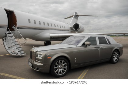 London, UK-7 MAY, 2019: Private Executive Airplane With Limousine Rolls Royce Phantom Luxury Car Shown Together At International Heathrow Airport. VIP Service At The Airport. Business-class Transfer.