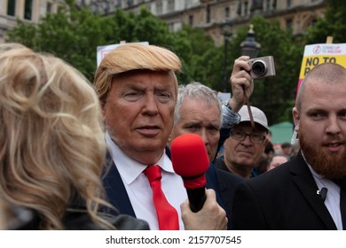 London, UK.June 4th, 2019. An impersonator of Donald Trump together with bodyguards seen being interviewed onTrafalgar Square at a anti-Trump rally. 