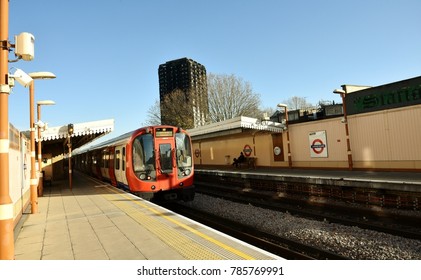 London, UK-November 25, 2017 Burnt, Grenfell Tower In The Background Of A Passing Tube Train At Latimer Road Station London, UK On November 25, 2017.