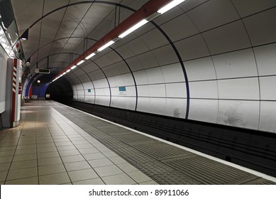 London Underground Train Station With A View Of The Tunnel Entrance.