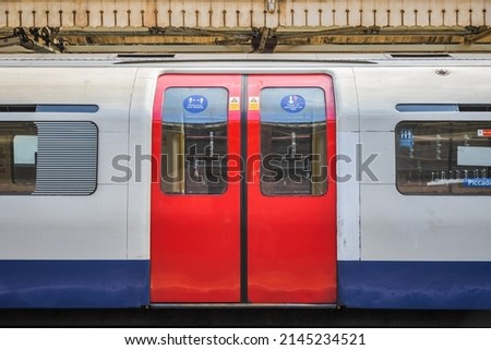 A London Underground tube train carriage with doors closed