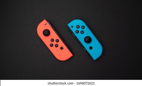 London / United Kingdom - 03 11 2020: Nintendo Switch Joy Con Neon Red And Blue