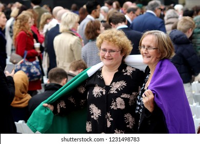 London / United Kingdom - 04.24.2018: Women Wearing The Suffrage Flag At The Unveiling Of The Statue Of Suffragette Millicent Fawcett At The Parliament Square