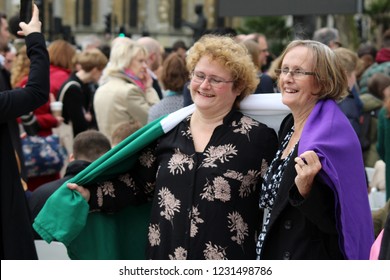 London / United Kingdom - 04.24.2018: Women Wearing The Suffrage Flag At The Unveiling Of The Statue Of Suffragette Millicent Fawcett At The Parliament Square