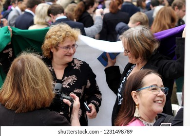 London / United Kingdom - 04.24.2018: Women Wearing The Suffrage Flag At The Unveiling Of The Statue Of Suffragette Millicent Fawcett At The Parliament Square