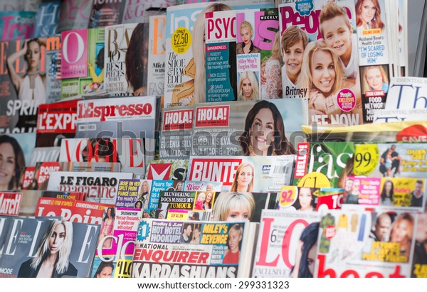 LONDON, UNITED KINGDOM- 1 APRIL 2015: Newsstand\
found in central London displaying many international titles such\
as Psychologies Magazine, InStyle, Vogue, Marie Claire and\
Harperâ??s Bazaar\
Magazine.