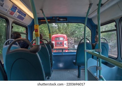 London, United Kingdom - 10 July 2012: Interior Of A Double Decker Bus In London. Blue Seats And Passengers.