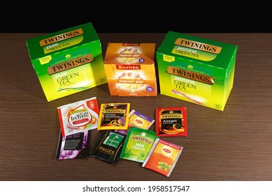 London, United Kingdom - April 04, 2021: Stack Of Famous British Tea Twinings And Other Different Brands Of Traditional Tea Bags Sold In Supermarkets.