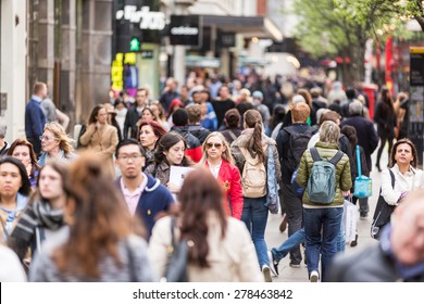 LONDON, UNITED KINGDOM - APRIL 17, 2015: Crowded sidewalk on Oxford Street with commuters and tourists from all over the world.