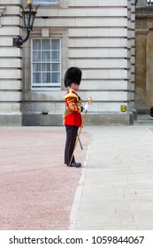 London, United Kingdom - April 23, 2015: The Drum Major Carries A Mace While Guiding A Military Band In The Grounds Of Buckingham Palace.