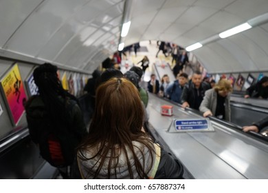 LONDON, UNITED KINGDOM - APRIL 6, 2016: People In London On The Escalator To Subway