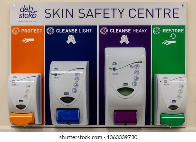 London / United Kingdom - April 8th 2019 : Deb Stoko Skin Safety Centre Cream Dispensers On A Wall In A Works Welfare Unit For Occupational Heath And Safety