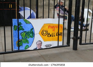 London / United Kingdom - August 15 2020: A banner featuring picture of Bill Gates  is seen during an anti vaccination protest by campaigners in Whitehall.