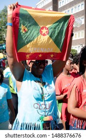 London, United Kingdom, August 25th 2019:-A  Reveller With The Flag Of Grenada At The Notting Hill Carnival In West London, The Notting Hill Carnival Is Europe's Largest Street Party.