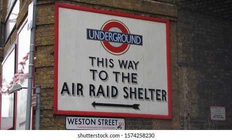 London, United Kingdom - August 6 2010: A sign indicating the way to an underground air raid shelter in London