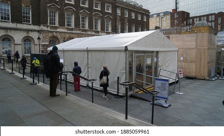 London, United Kingdom - December 31 2020: NHS Staff Of Queue For COVID19 Vaccine In Popup Distribution Centre. Forecourt Of Guy's Hospital In Central London.