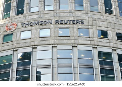 London, United Kingdom - February 03, 2019: Sun shines on Thomson Reuters offices building at Canary Wharf in UK capital. TR Group is Canadian multinational mass media and information firm