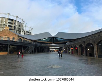 London / United Kingdom - January 25 2019: Coal Drops Yard Shopping Mall And Gasholders Buildings Kings Cross St Pancras Daytime People Restaurants Cafes Shops Architecture