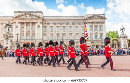 LONDON, UNITED KINGDOM - JULY 11, 2012: Officers and soldiers of the Coldstream Guards march in front of Buckingham Palace during the Changing of the Guard ceremony