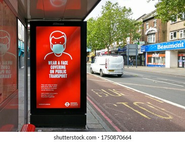 London, United Kingdom - June 06, 2020: Light Ad At Lewisham Bus Stop Prompting Passengers To Wear Protective Virus Face Mask In Public Transport During Coronavirus Outbreak.