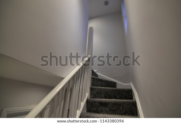 London, United Kingdom, June 2018 The interior of a\
typical house in the suburbs of London. In the photo the internal\
staircase leading to the first floor and the attic. Usually a bit\
narrow and steep
