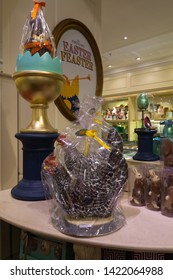 London / United Kingdom - March 20 2017: Interior of a fancy chocolate shop where prices are very high. Easter-Feaster chocolate chickens wrapped into film paper.