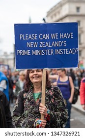 LONDON, UNITED KINGDOM - March 23, 2019: Put it to the People march to demand a referendum on Brexit. Woman with banner in Whitehall saying 'Please can we have New Zealand's Prime Minister instead'. 