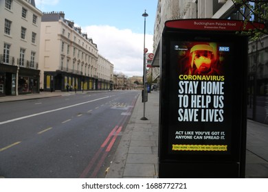 LONDON, UNITED KINGDOM - MARCH 31 2020:  A Deserted Bus Stop With A Warning Ad Is Seen On Buckingham Palaca Road As The Lockdown Continues Due To Coronavirus (COVID1-19) Pandemic In London, England. 