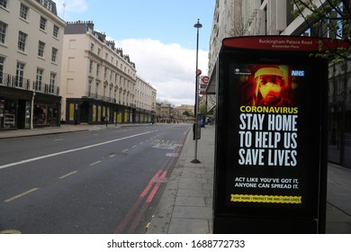 LONDON, UNITED KINGDOM - MARCH 31 2020:  A Deserted Bus Stop With A Warning Ad Is Seen On Buckingham Palaca Road As The Lockdown Continues Due To Coronavirus (COVID1-19) Pandemic In London, England. 