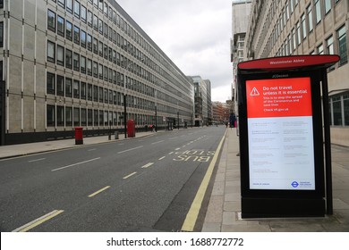 LONDON, UNITED KINGDOM - MARCH 31 2020: A Deserted Bus Stop With A Warning Ad On Victoria Street Is Seen Deserted As The Lockdown Continues Due To Coronavirus (COVID1-19) Pandemic In London, England. 