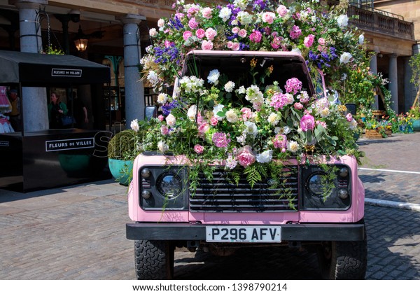LONDON, UNITED KINGDOM - MAY 15th, 2019:\
Covent Garden celebrates its heritage as London’s original flower\
market with elaborated floral\
installations