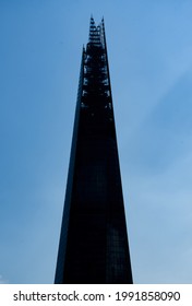 London, United Kingdom - May 29 2021:  A Silhouette Of The Top Floors Of The Shard Skyscraper From The Thames Path