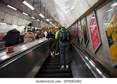 LONDON, UNITED KINGDOM - Nov 01, 2021: A Group Of People Leaving The Subway On An Escalator In London, The UK