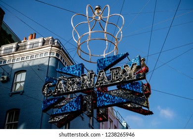 London, United Kingdom, November 17th 2018:- Sign Above Carnaby Street In The Soho Area Of London, Famous Since The 1960s For Its Independent Fashion Shops.