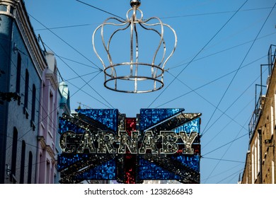 London, United Kingdom, November 17th 2018:- Sign Above Carnaby Street In The Soho Area Of London, Famous Since The 1960s For Its Independent Fashion Shops.