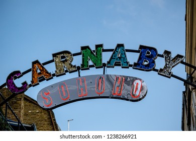 London, United Kingdom, November 17th 2018:- Sign Above Carnaby Street In The Soho Area Of London, Famous Since The 1960s For Its Independent Fashion Shops.