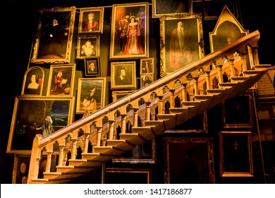 London / United Kingdom - November 23 2017: Warner Bros Harry Potter Studio. Staircases in Hogwarts Castle. They were surrounded by paintings of old wizards. Stairs sometimes changed their course.