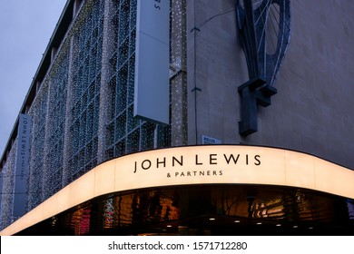 London / United Kingdom — November 26, 2019: the logo of John Lewis & Partners at the entrance to the company's flagship department store on Oxford Street, a major shopping street in London, UK
