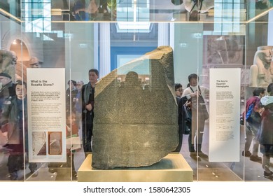 LONDON, UNITED KINGDOM - NOVEMBER 7, 2019: The Rosetta Stone is protected by bulletproof glass boxes in the British Museum, London, United Kingdom.
