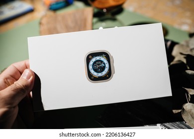 London, United Kingdom - Sep 23, 2022: Athlete Holding Unboxing Unpacking Of New Titanium Apple Watch Ultra Designed For Extreme Activities Like Endurance Sports, Elite Athletes, Trailblazing